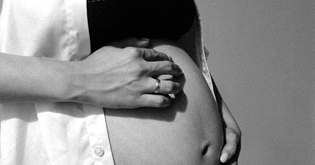 A stock image of a pregnant person
