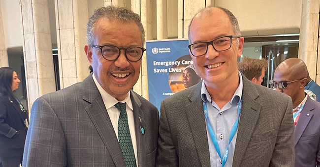 Associate Professor Wayne Morriss, right, with Dr Tedros Adhanom Ghebreyesus, WHO Director-General, World Health Assembly in Geneva, Switzerland, May 2023.