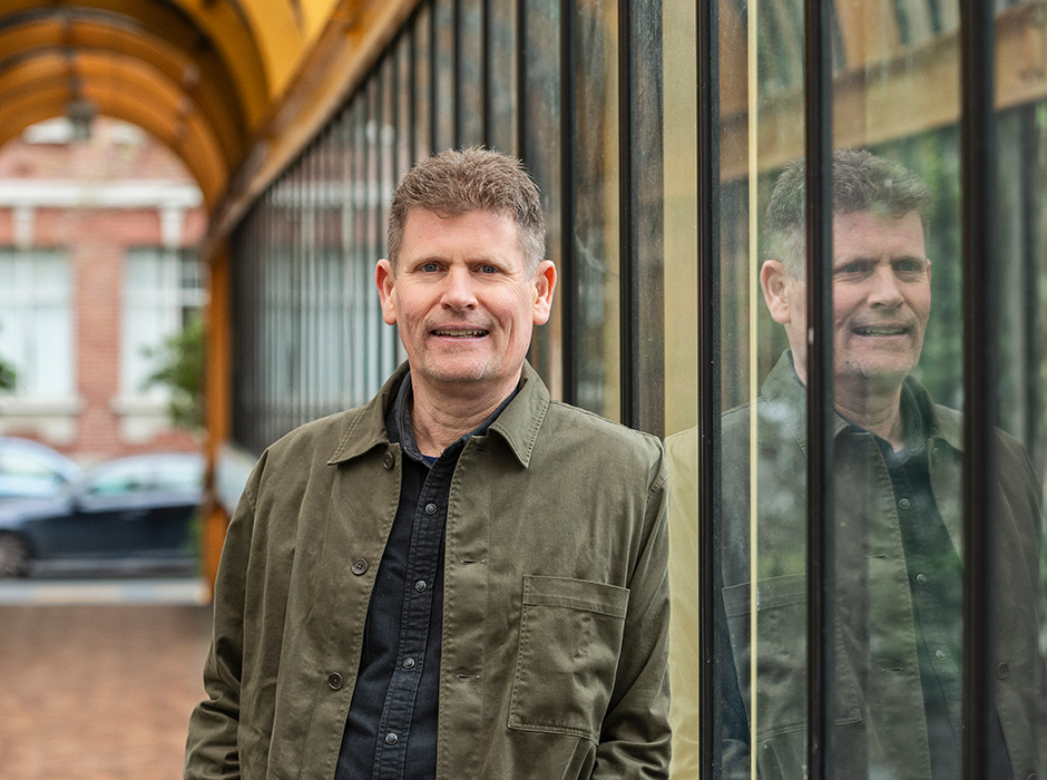 A man standing in front of a window