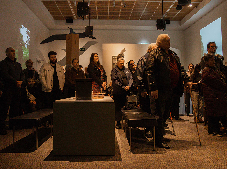 A group of people standing among the display