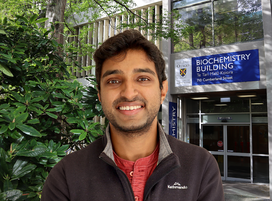 Zohaib Rana in front of biochemistry building entrance