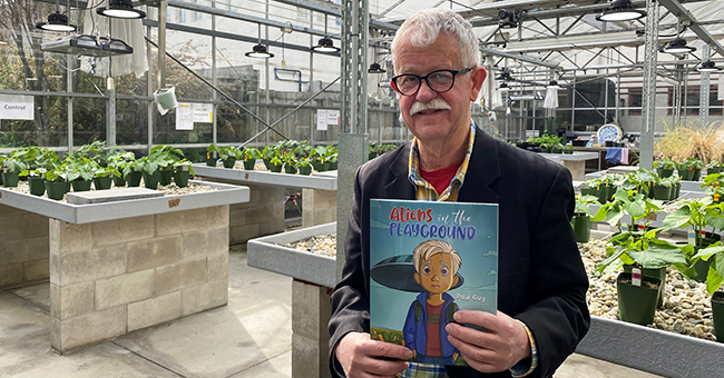 Paul Guy with his book