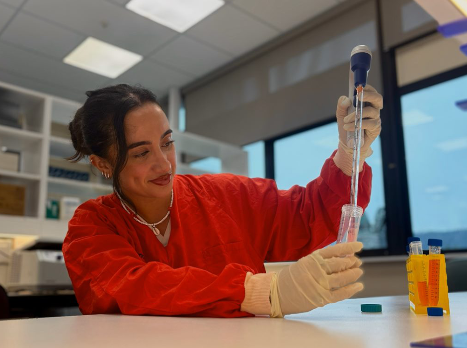 a woman working with a pipette