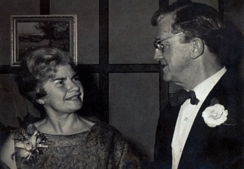 A black and white photo of Dan and Gwen Taylor at a function