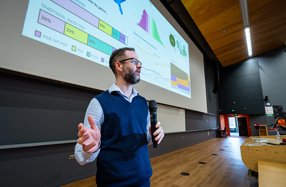 Lecturer in front of projector screen