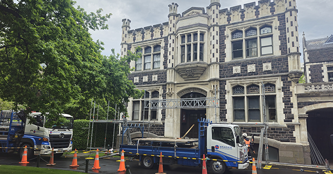 Marama Hall with work trucks parked around it