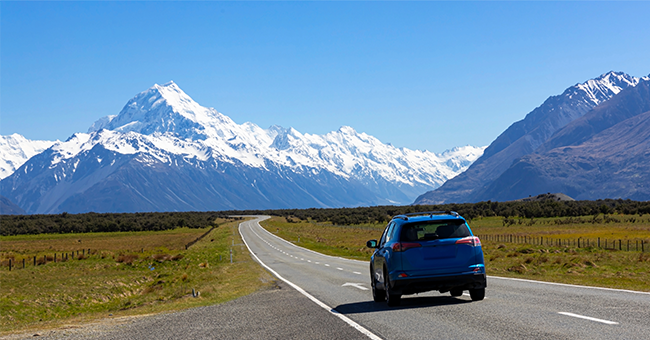 Car driving on the open roads of New Zealand. 