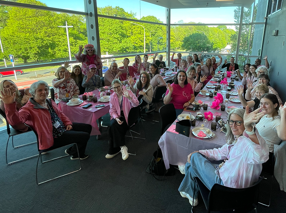 Group shot of More than 30 UOC staff and students who gathered for a fundraising breakfast on campus to support the Sweet Louise breast cancer charity. 