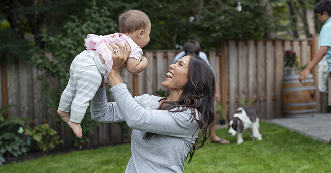 RTRU card image - a woman holding a baby