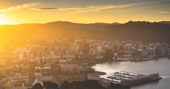 View looking north-west across Wellington harbour at sunset.