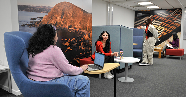 Library Assistant Michaella Simpson with medical students Sara Aruquipa Southerwood and Sandra Dondi and Resource Access and Interloans Librarian Jung Cho in the informal study space. 