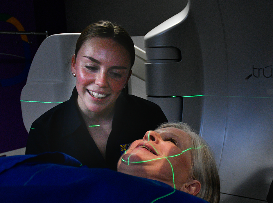 Radiation Therapy student Ellen Emerson works with a patient during a clinical placement.