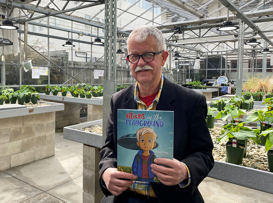 Paul Guy with his book