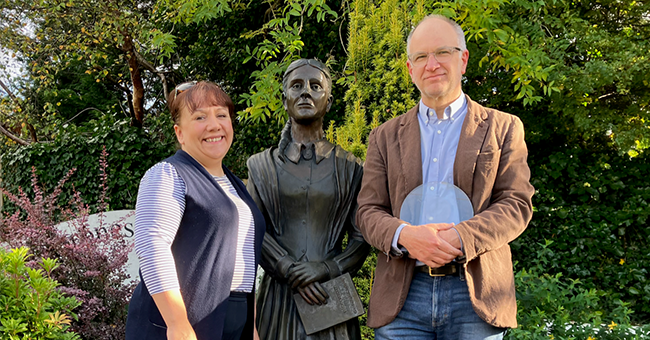 Associate Professor Thomas McLean is pictured with a member of the Frances Browne Literary Festival Committee, Shirley-Anne Bonner, at the Frances Browne statue in Stranorlar, Ireland. 