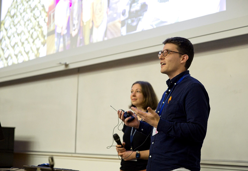 Dr Max Yavitt and Theresa Konig deliver presentations in a lecture theatre.