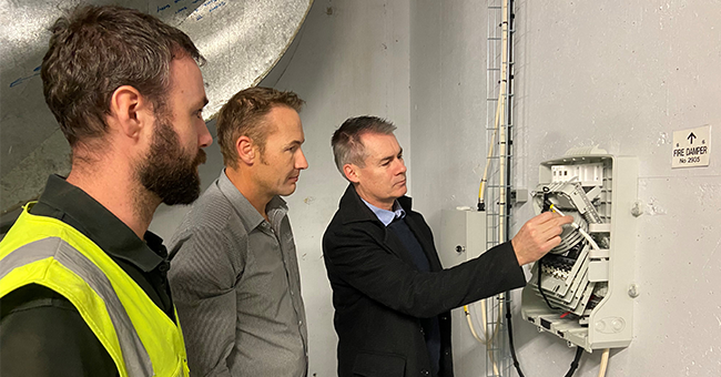 Checking it out … CommScope Business Development Manager Craig Gilmore (right) shows some of the subtle features of the Fibre BUDI – wall mountable distribution boxes – to (from left) Aotea Site Foreman Nick Martin and Aotea Assistant Communications Manager Simon Perry. 