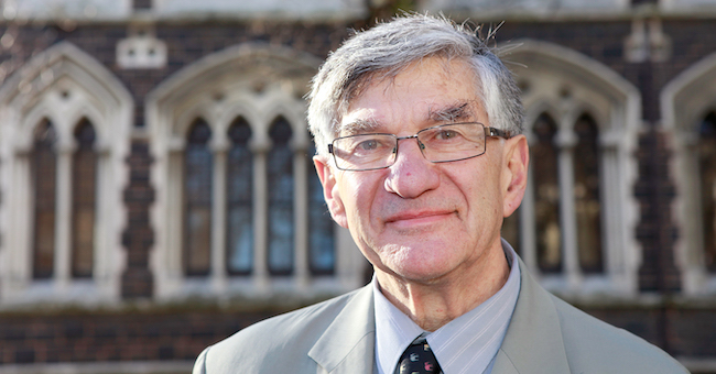 Photo of Professor Jim Mann in front of the University clocktower