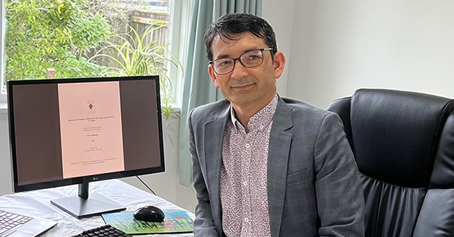 Hussain Raissi at his desk