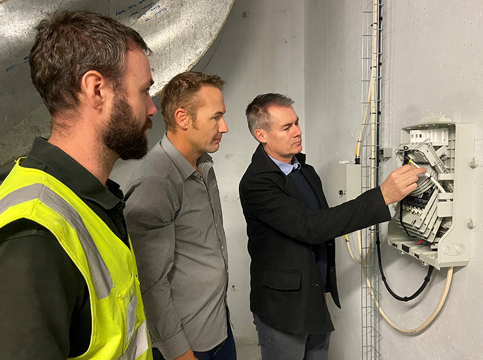 Checking it out … CommScope Business Development Manager Craig Gilmore (right) shows some of the subtle features of the Fibre BUDI – wall mountable distribution boxes – to (from left) Aotea Site Foreman Nick Martin and Aotea Assistant Communications Manager Simon Perry. 