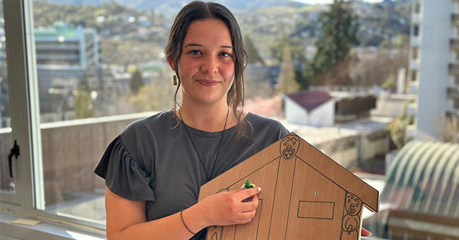 PhD tauira Sequoia Short with one of the puzzles she uses in her escape room which centres on Indigenous data sovereignty.