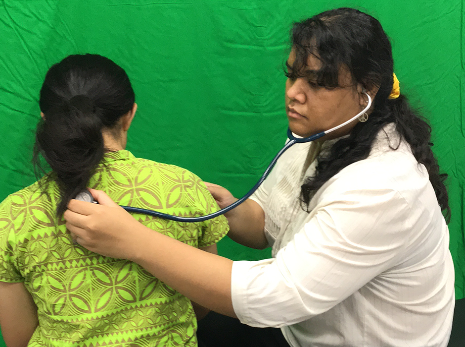 A female physiotherapist helping another woman