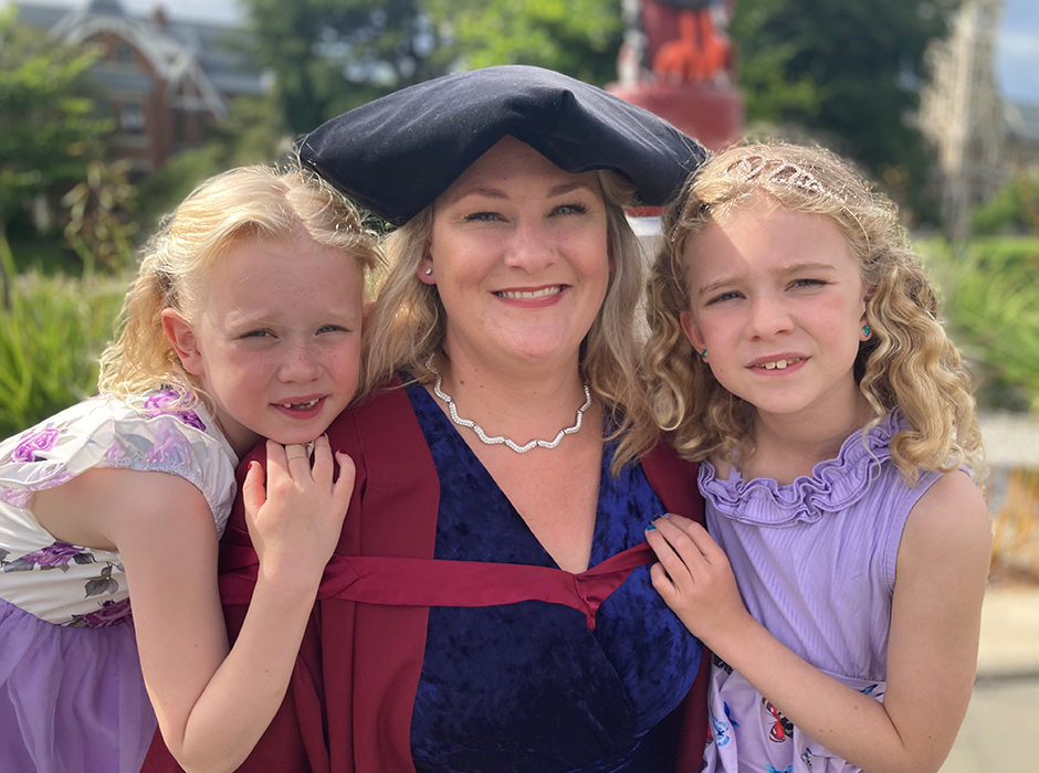 Michelle on graduation day with her daughters.