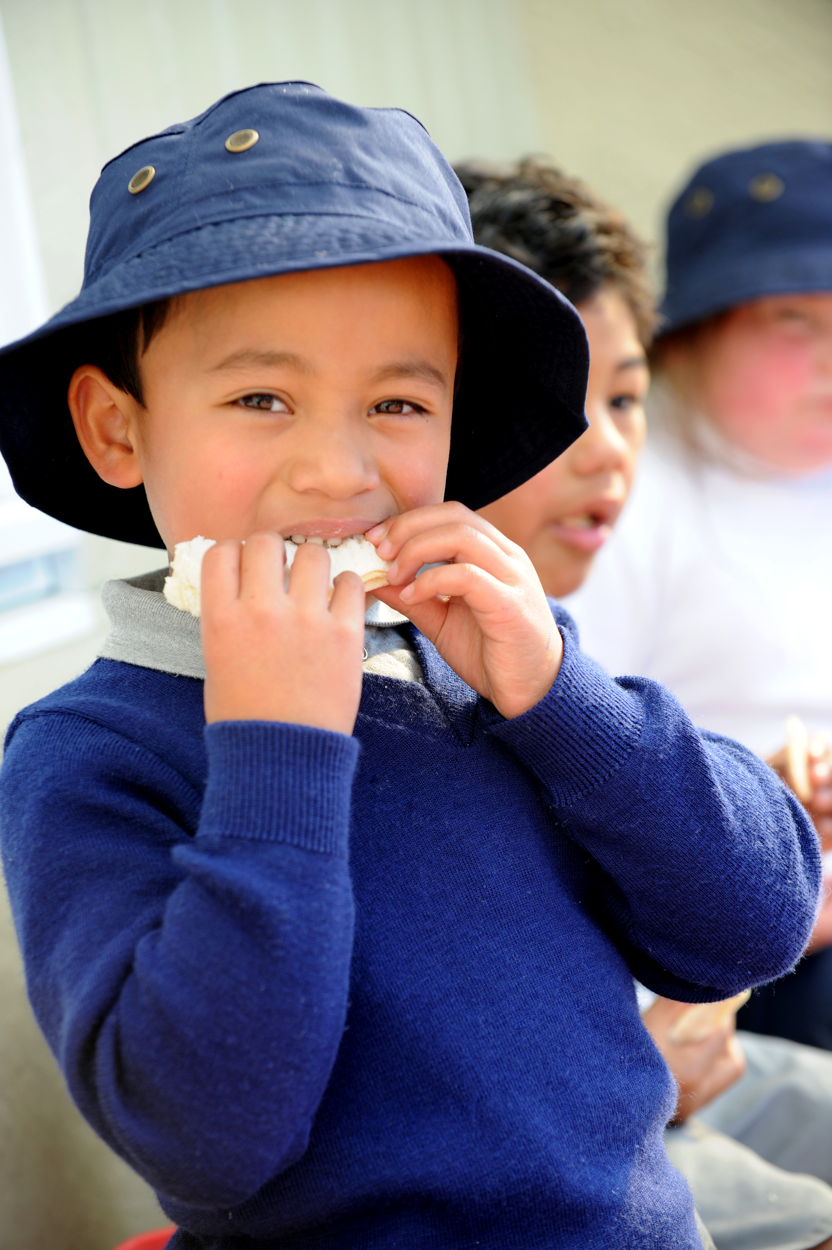 child eating sandwich 