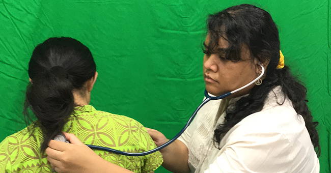 A female physiotherapist helping another woman