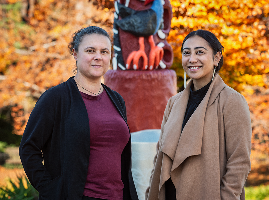 Two women standing next to each other 