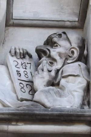 A photo of the stone carving above the archweay of the Philosophy department building