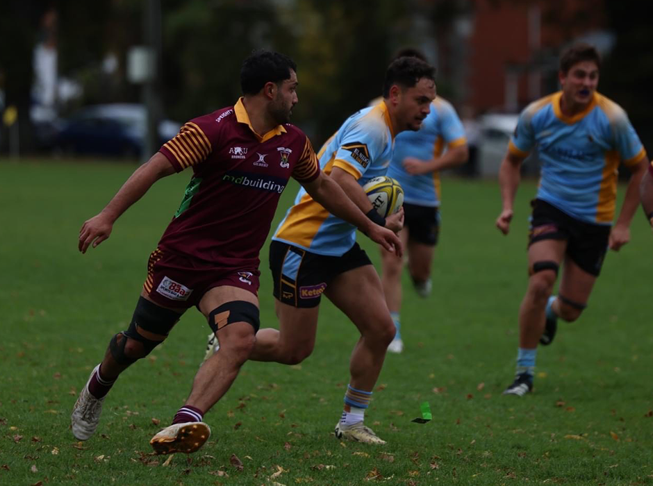 Two men playing rugby