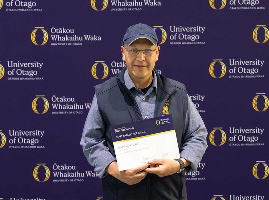 A man holding an award