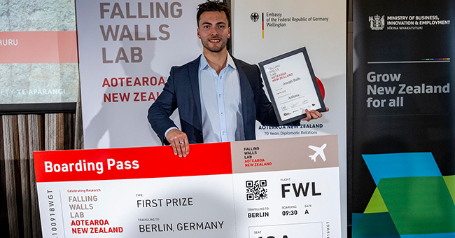 Joseph Balfe receiving his 2024 Falling Walls Lab Aotearoa New Zealand pitch competition prize 